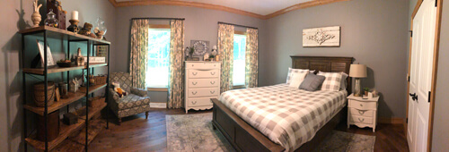 Panorama of a bedroom with a sitting area