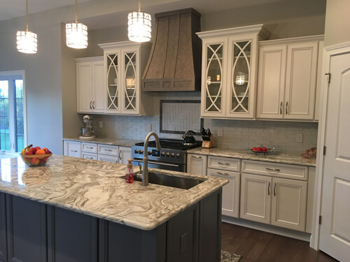 Kitchen cabinets, counters, and island